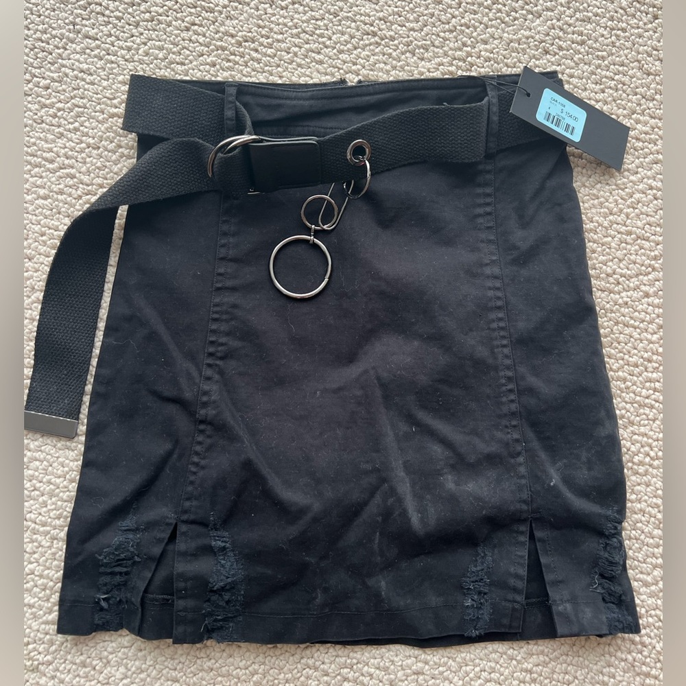 Carmar- denim black skirt with belt and silver ring accessory.